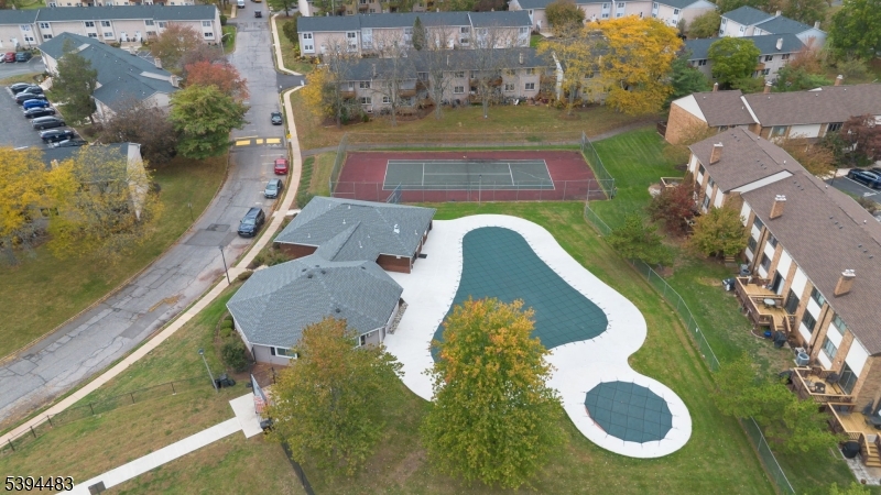 919 Robin Road Hillsborough, NJ 08844 - Photo 3 of 21 an aerial view of a house with swimming pool and large trees