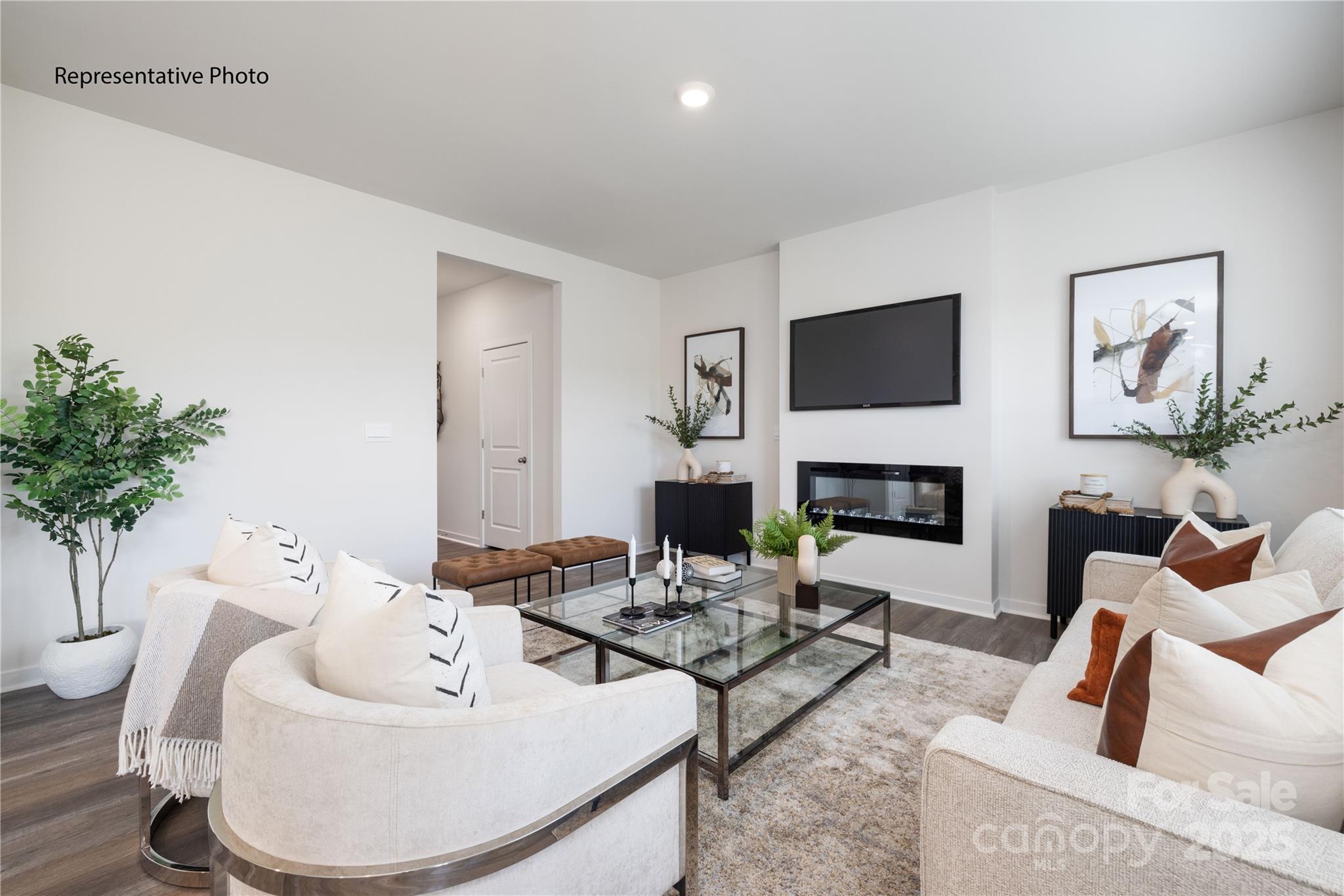 1414 Mammoth Road Hickory, NC 28602 - Photo 6 of 24 a living room with furniture a fireplace and a potted plant