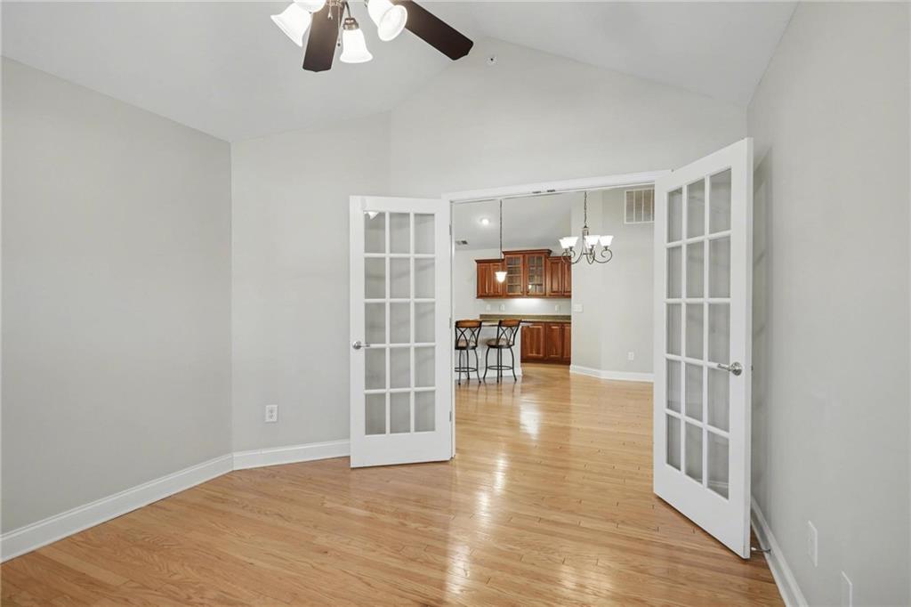 214 Highlands Ridge Place, Unit 3 Smyrna, GA 30082 - Photo 12 of 25 wooden floor in an empty room with a window
