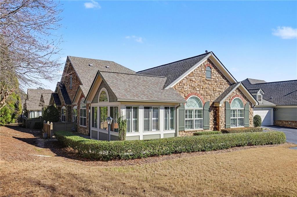 214 Highlands Ridge Place, Unit 3 Smyrna, GA 30082 - Photo 2 of 25 front view of a house with a porch