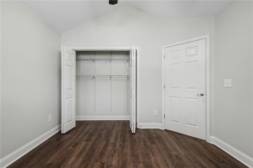 214 Highlands Ridge Place, Unit 3 Smyrna, GA 30082 - Photo 21 of 25 an empty room with wooden floor and closet