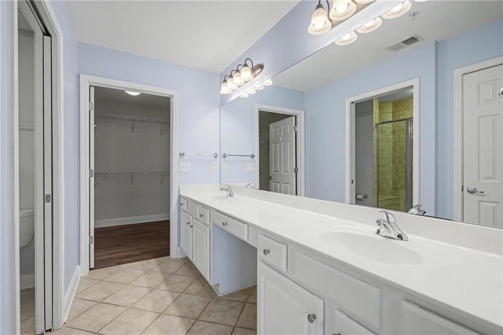 214 Highlands Ridge Place, Unit 3 Smyrna, GA 30082 - Photo 22 of 25 a bathroom with a double vanity sink and a mirror