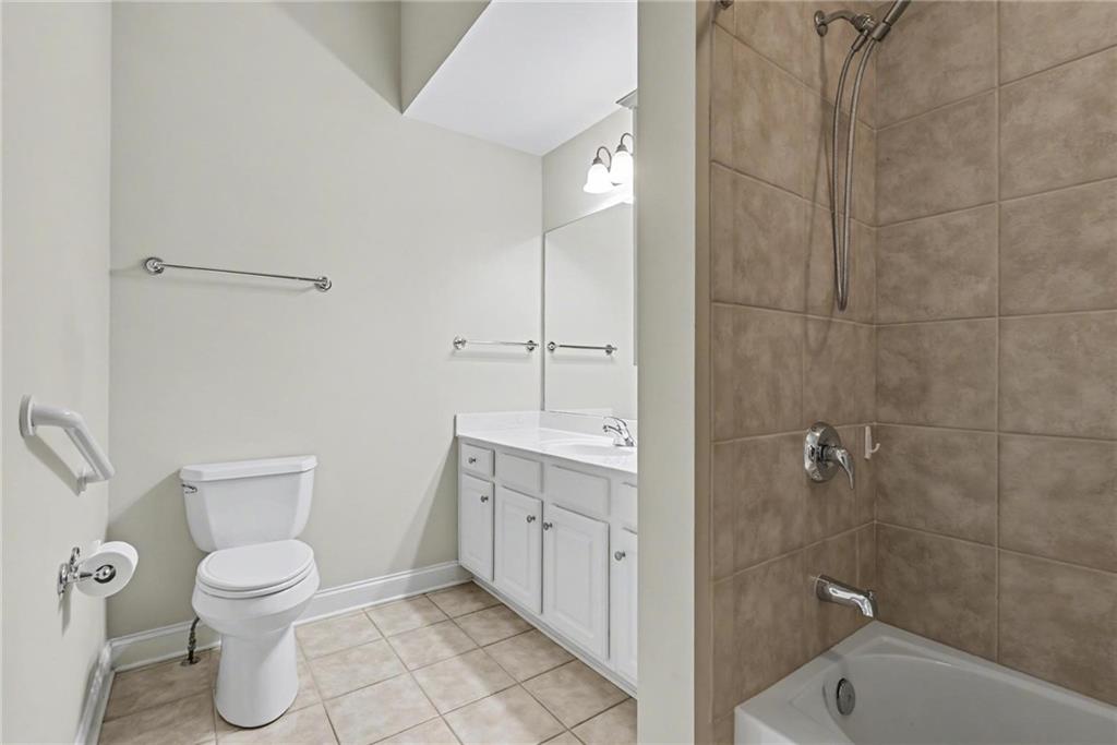 214 Highlands Ridge Place, Unit 3 Smyrna, GA 30082 - Photo 23 of 25 a bathroom with a toilet a sink and shower