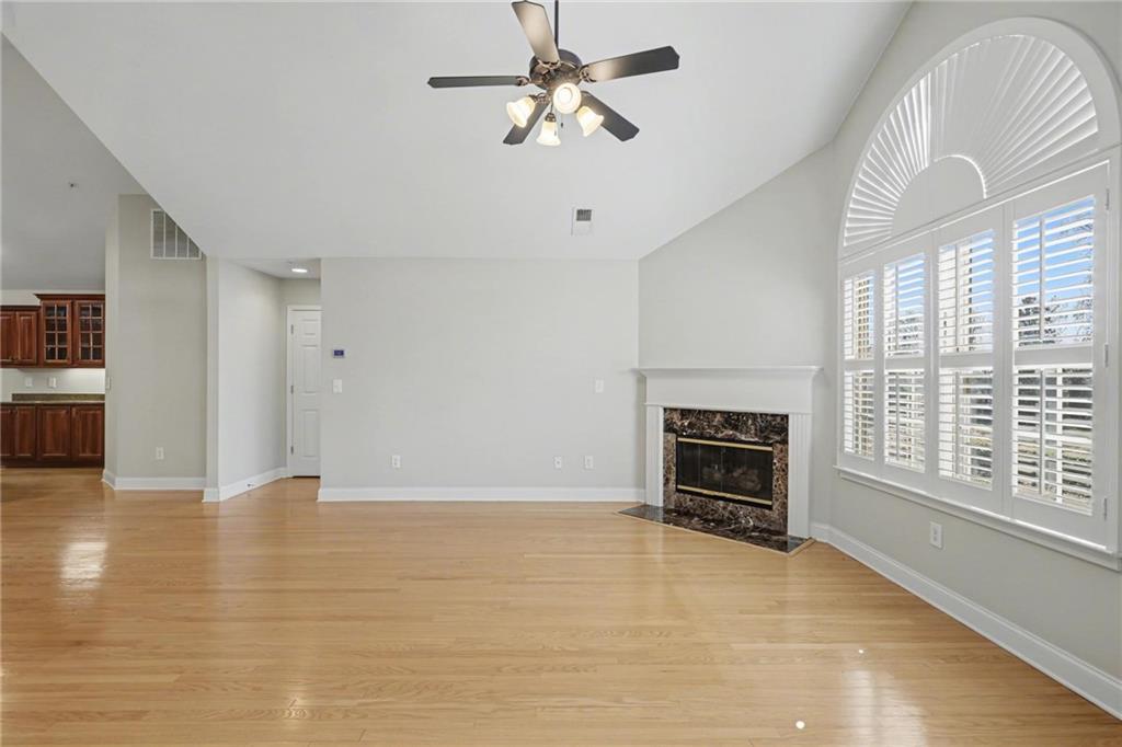 214 Highlands Ridge Place, Unit 3 Smyrna, GA 30082 - Photo 7 of 25 a view of a livingroom with a ceiling fan window and a fireplace