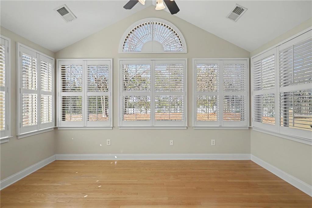 214 Highlands Ridge Place, Unit 3 Smyrna, GA 30082 - Photo 10 of 25 a view of an empty room with wooden floor and a window