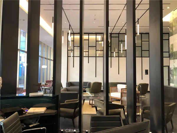 a room with lots of furniture and windows