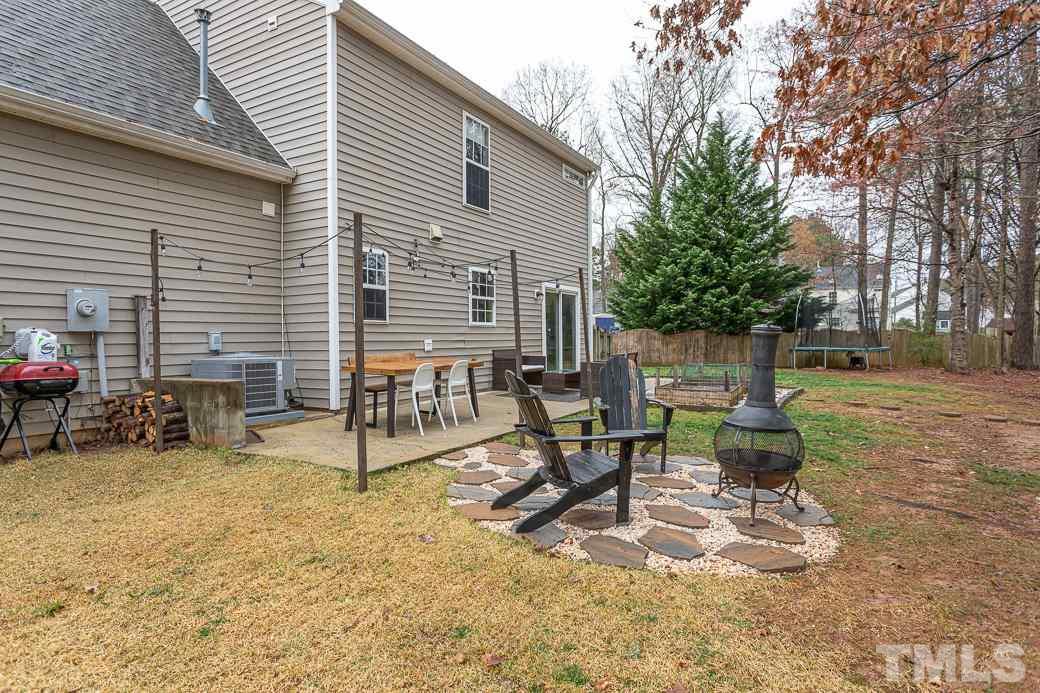 9312 Copernicus Court Raleigh, NC 27617 - Photo 27 of 30 Multiple patio areas for relaxing, grilling, and enjoying summer evenings.