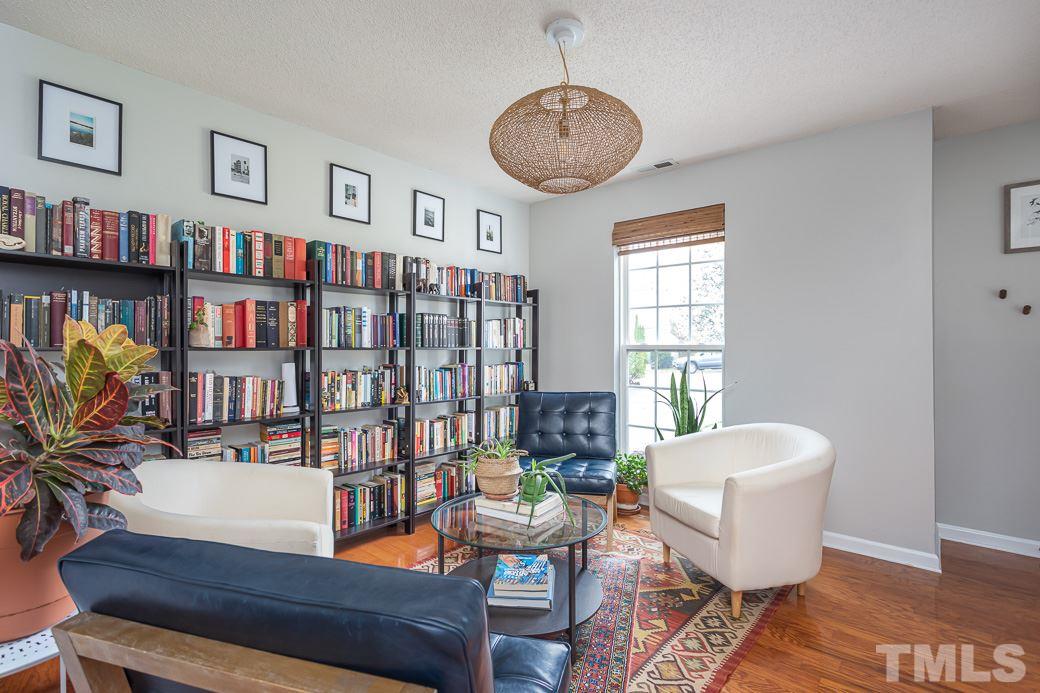 Multi-functional space with hardwood floors and access to the adjoining kitchen.