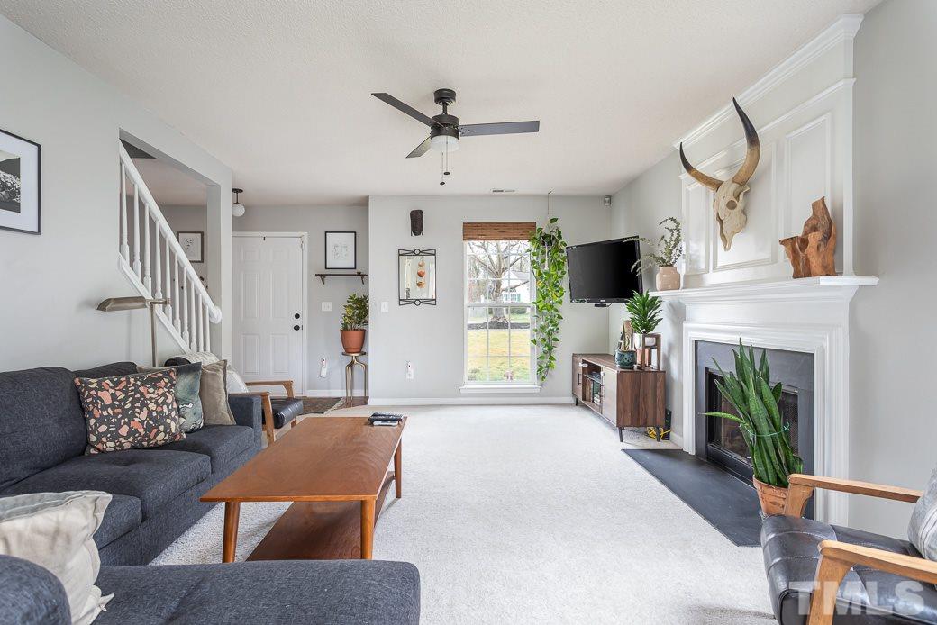 Spacious and bright family room with fireplace.