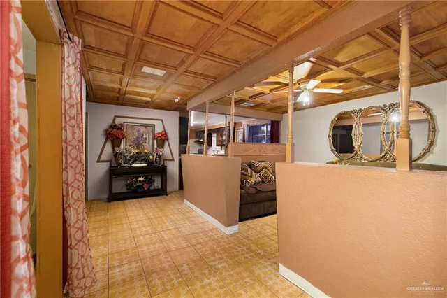 a living room with furniture and flowers