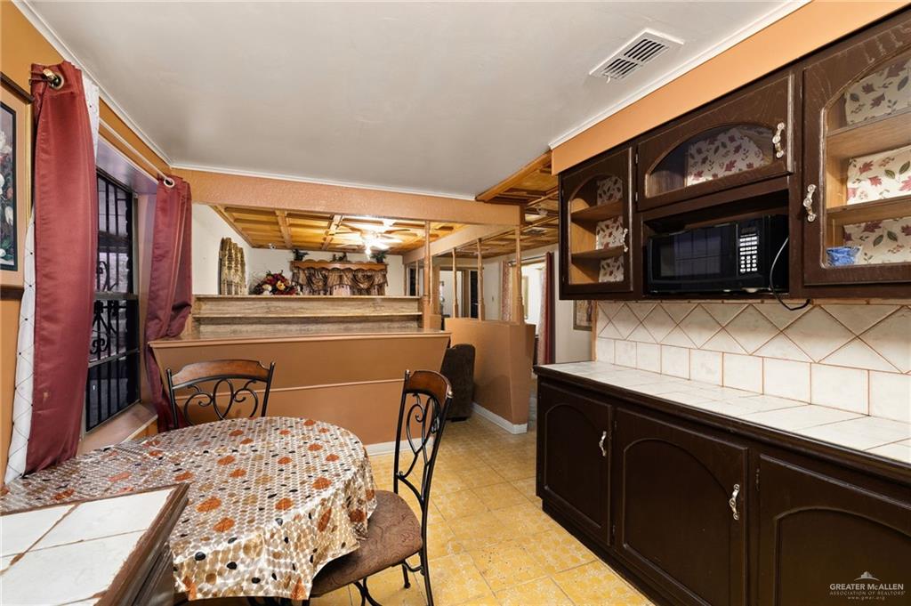 264 West Huisache Street Rio Grande City, TX 78582 - Photo 7 of 16 a view of a chairs and a table in the balcony