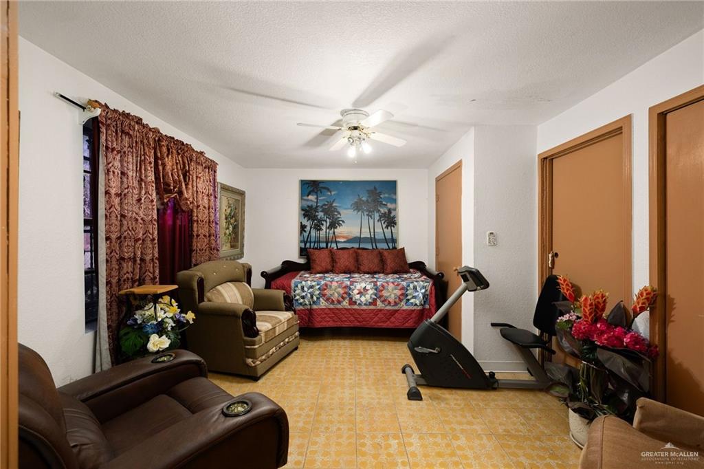 264 West Huisache Street Rio Grande City, TX 78582 - Photo 8 of 16 a bedroom with furniture and a window