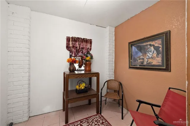 a view of a livingroom with a projector and furniture