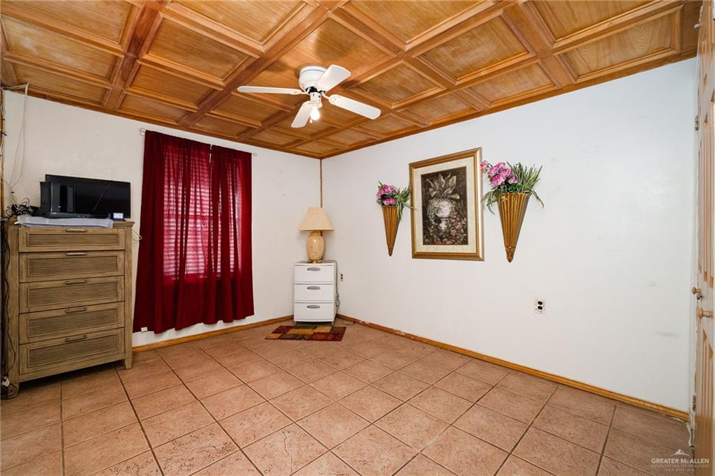 264 West Huisache Street Rio Grande City, TX 78582 - Photo 10 of 16 a view of a livingroom with a projector and furniture