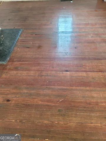 a bathroom with a granite countertop bathtub shower and toilet