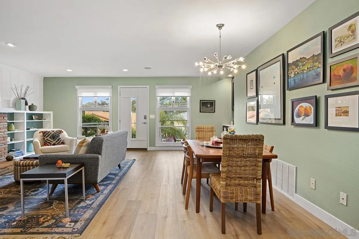 3433 Alabama Street San Diego, CA 92104 - Photo 13 of 58 a living room with furniture dining table and a chandelier