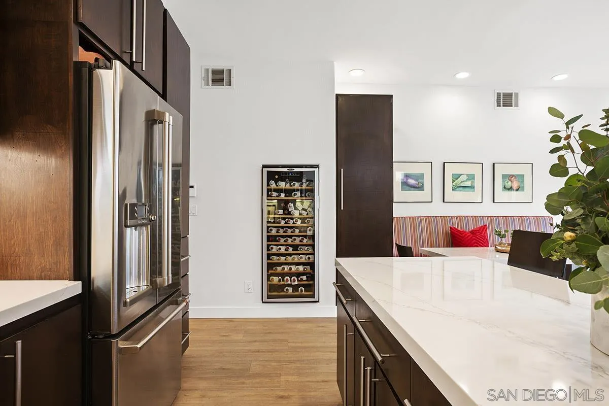 3433 Alabama Street San Diego, CA 92104 - Photo 16 of 58 a kitchen with stainless steel appliances kitchen island granite countertop a refrigerator and a sink
