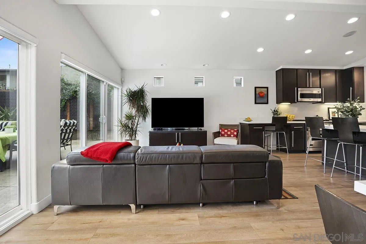 3433 Alabama Street San Diego, CA 92104 - Photo 24 of 58 a living room with furniture and a flat screen tv