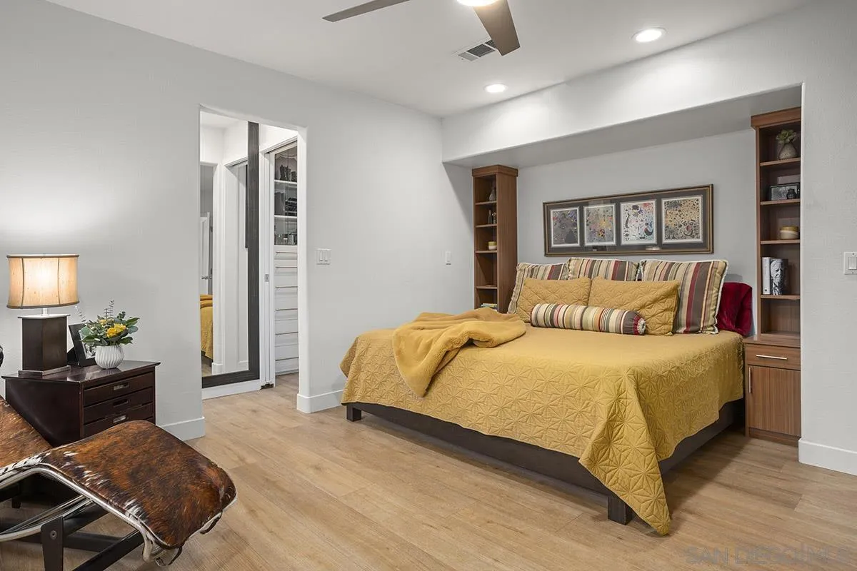 3433 Alabama Street San Diego, CA 92104 - Photo 28 of 58 a bedroom with a bed and wooden floor