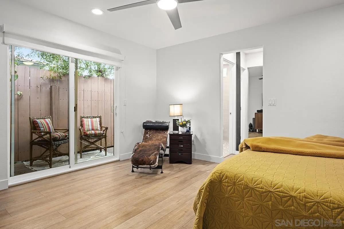 3433 Alabama Street San Diego, CA 92104 - Photo 29 of 58 a bedroom with a bed and a large window