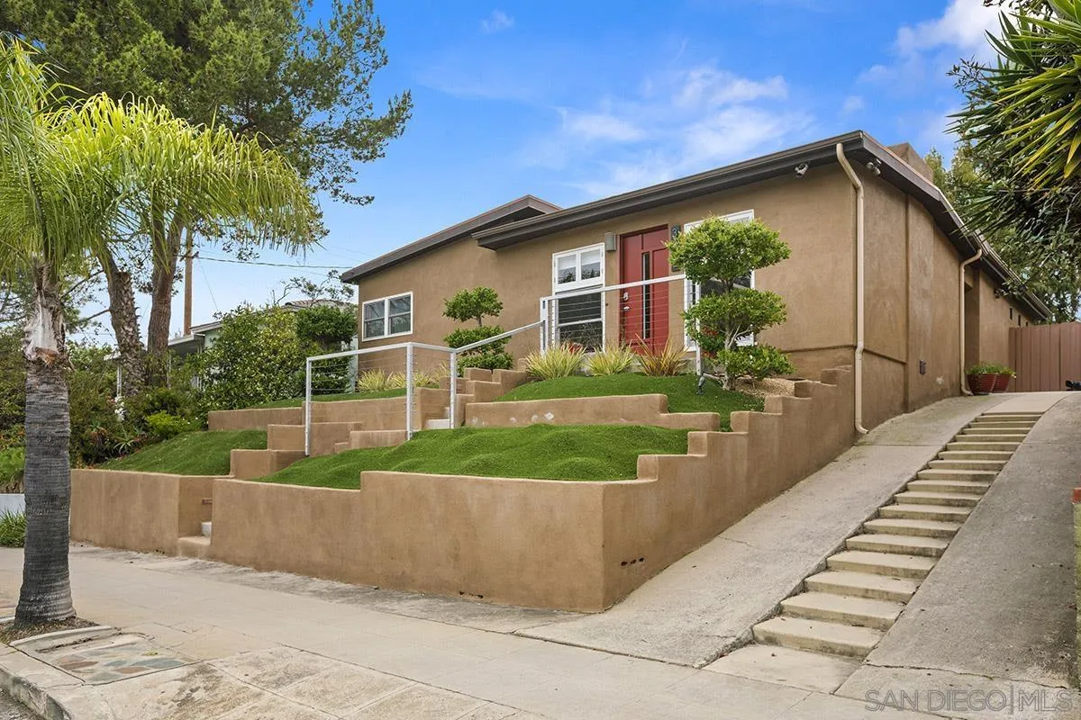 3433 Alabama Street San Diego, CA 92104 - Photo 3 of 58 a front view of a house with a yard and potted plants
