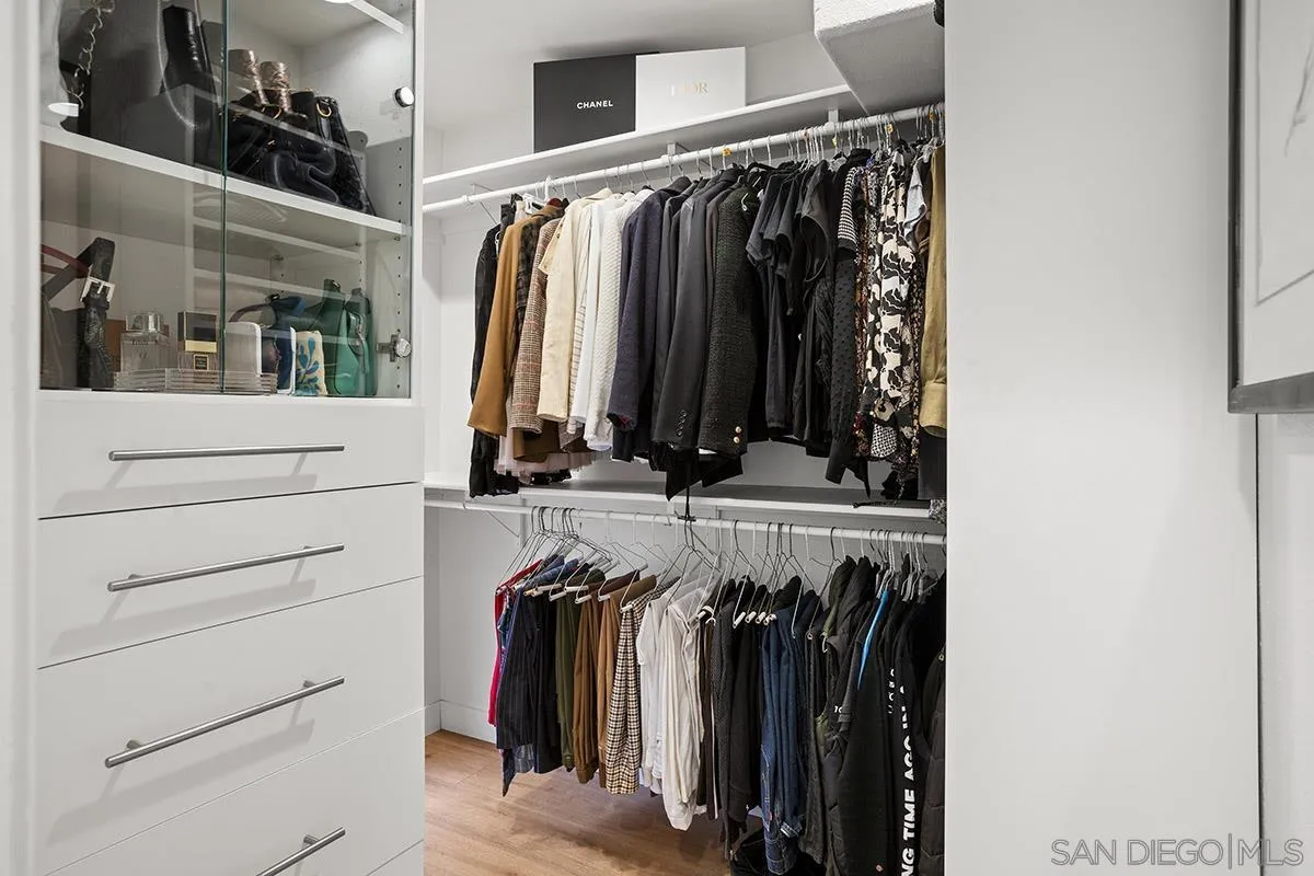 3433 Alabama Street San Diego, CA 92104 - Photo 31 of 58 a view of walk in closet with clothes and shoes