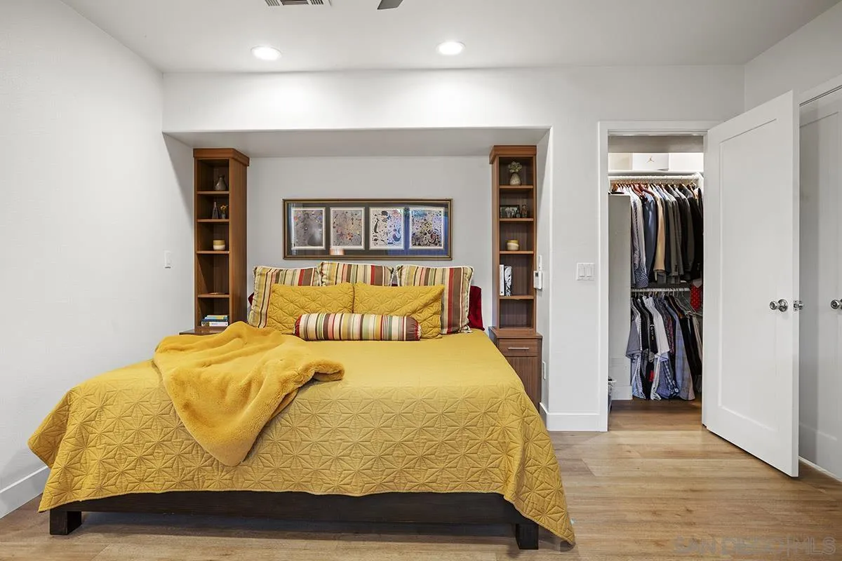 3433 Alabama Street San Diego, CA 92104 - Photo 33 of 58 a bedroom with a bed and a walk in closet