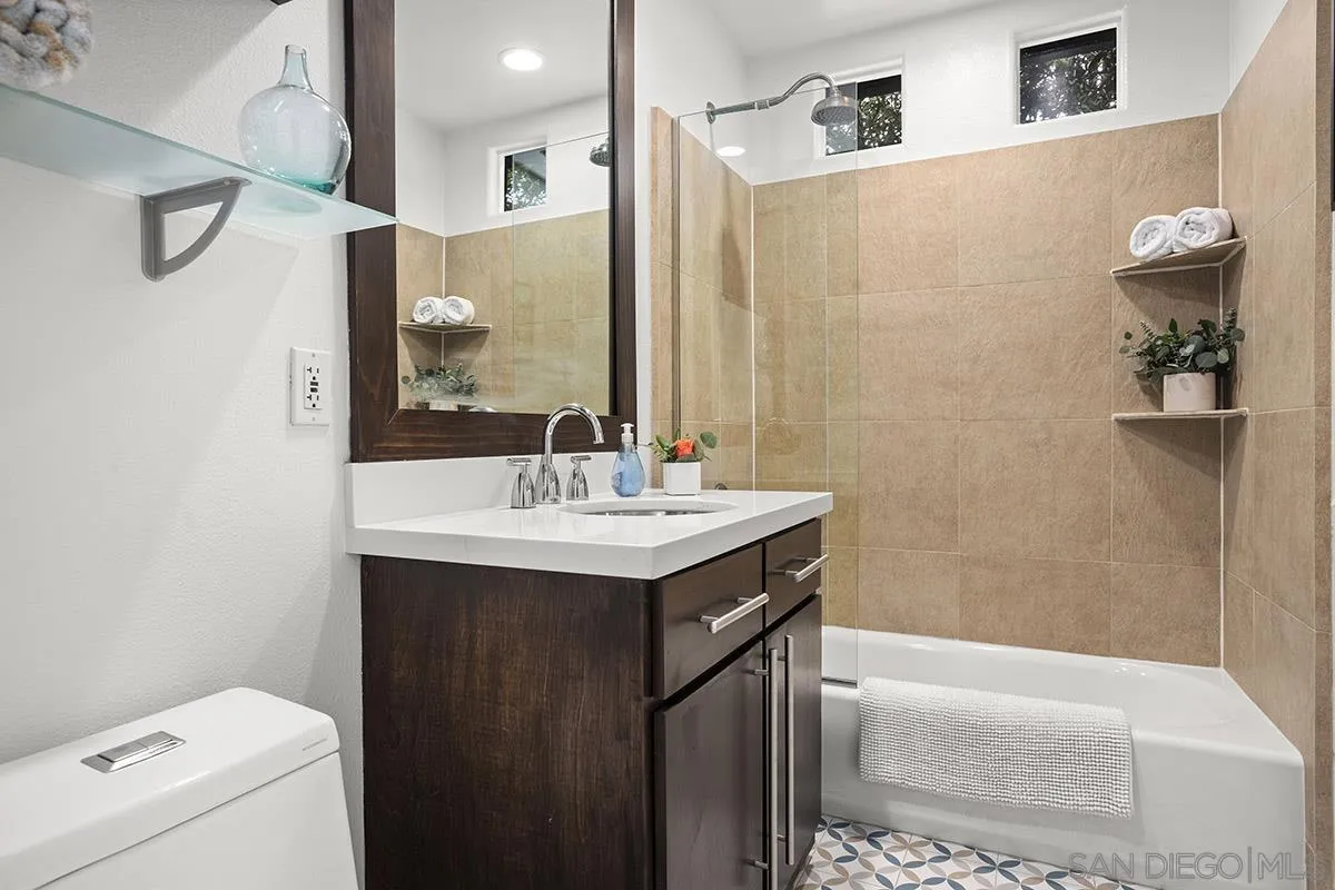 3433 Alabama Street San Diego, CA 92104 - Photo 36 of 58 a bathroom with a sink a toilet and shower