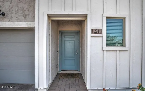 a view of a hallway with a wooden door
