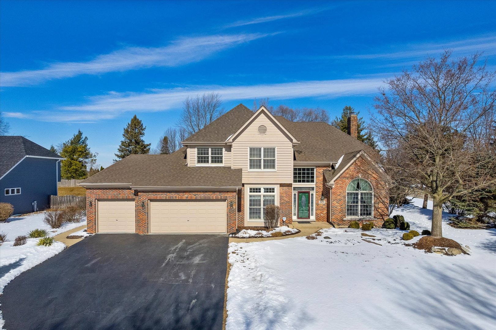 a view of a white house with a yard