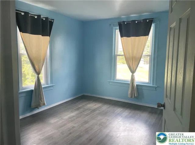 a view of front door and wooden floor