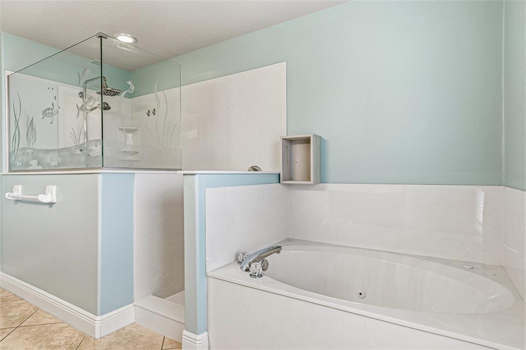 4821 Falcon Boulevard Cocoa, FL 32927 - Photo 24 of 48 a bathroom with a bathtub and a shower