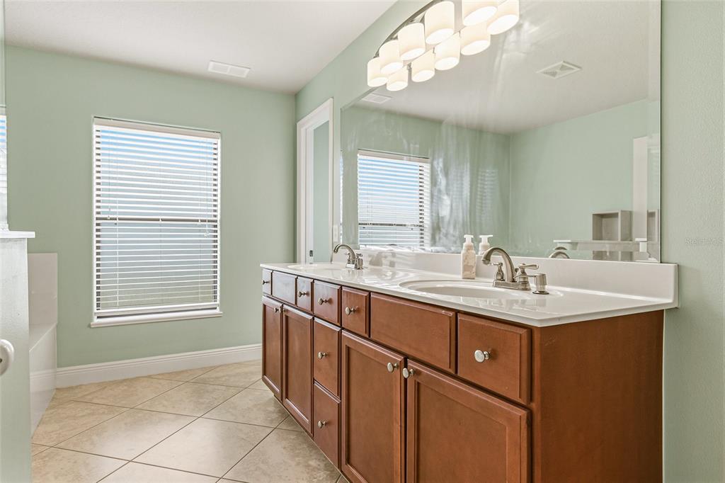 4821 Falcon Boulevard Cocoa, FL 32927 - Photo 25 of 48 a bathroom with a sink a vanity and a mirror