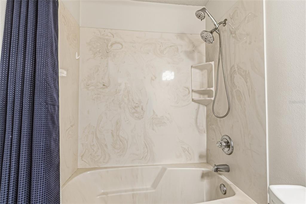 4821 Falcon Boulevard Cocoa, FL 32927 - Photo 29 of 48 a bathroom with a bath tub with a shower