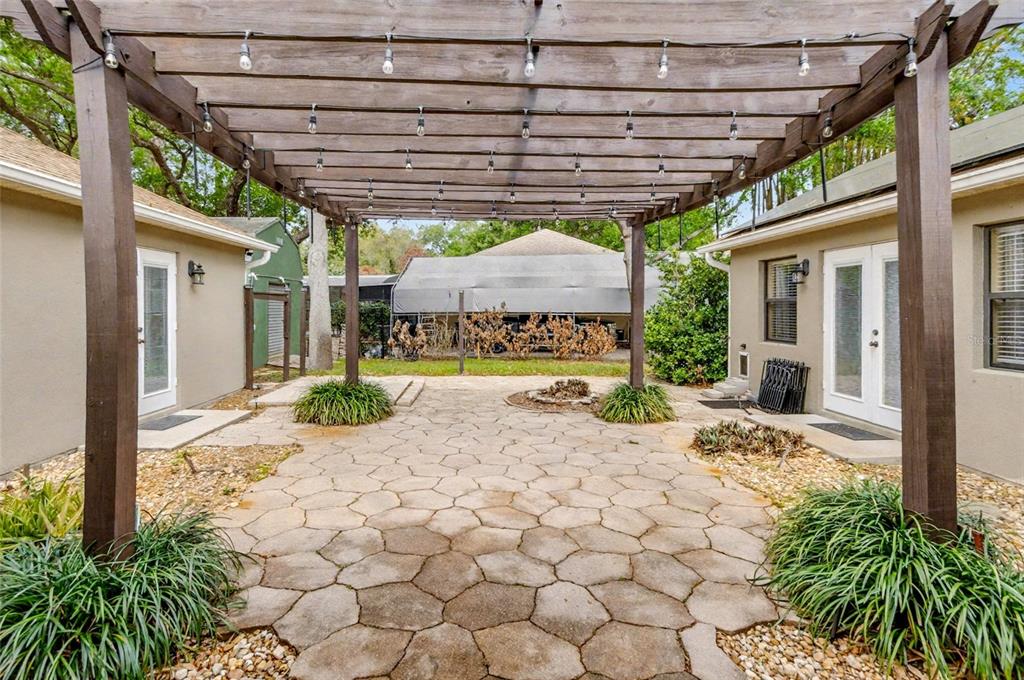 4821 Falcon Boulevard Cocoa, FL 32927 - Photo 3 of 48 a patio with a patio table and chairs