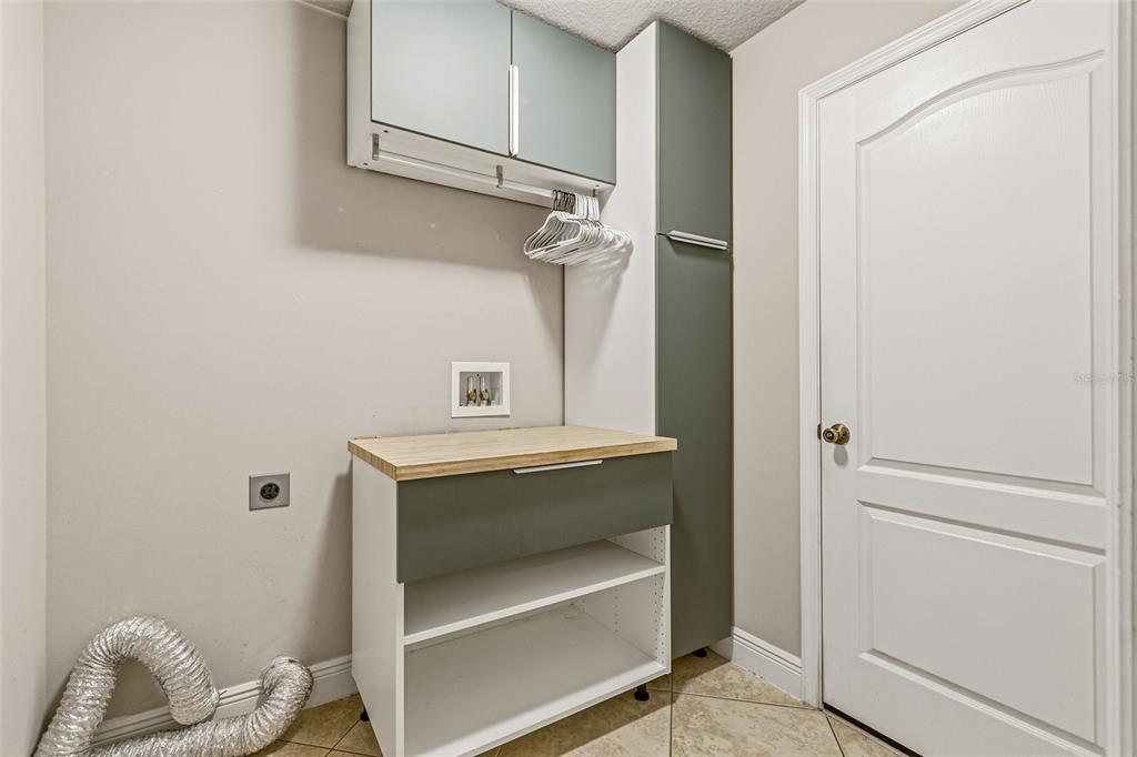 4821 Falcon Boulevard Cocoa, FL 32927 - Photo 33 of 48 a view of storage and utility room with racks on the wall