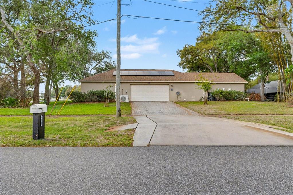 4821 Falcon Boulevard Cocoa, FL 32927 - Photo 39 of 48 a front view of a house with garden