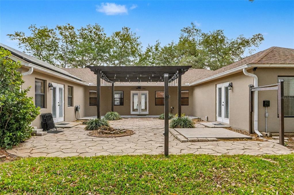 4821 Falcon Boulevard Cocoa, FL 32927 - Photo 4 of 48 a front view of a house with garden