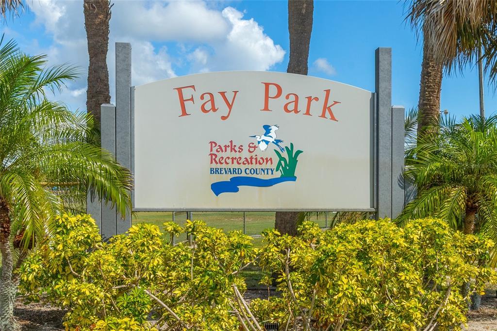 4821 Falcon Boulevard Cocoa, FL 32927 - Photo 43 of 48 a sign that is in front of flowers