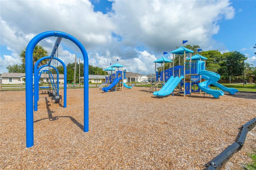 4821 Falcon Boulevard Cocoa, FL 32927 - Photo 46 of 48 a childrens park with lots of swings and slides