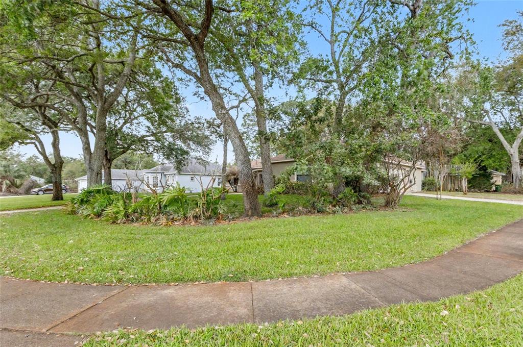 4821 Falcon Boulevard Cocoa, FL 32927 - Photo 6 of 48 a view of a garden with trees