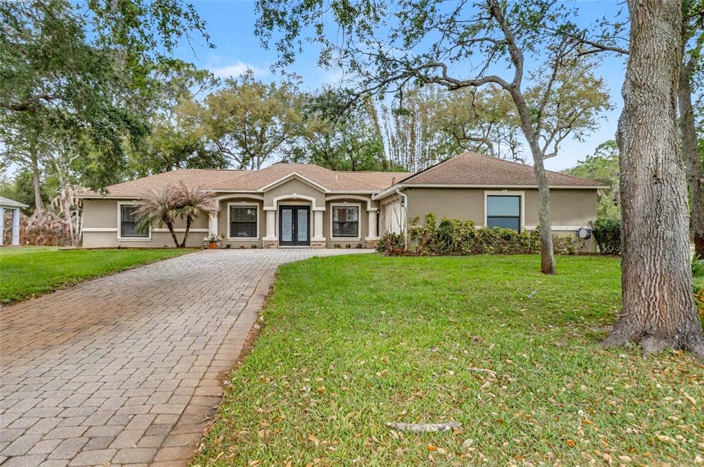 4821 Falcon Boulevard Cocoa, FL 32927 - Photo 7 of 48 a front view of a house with garden