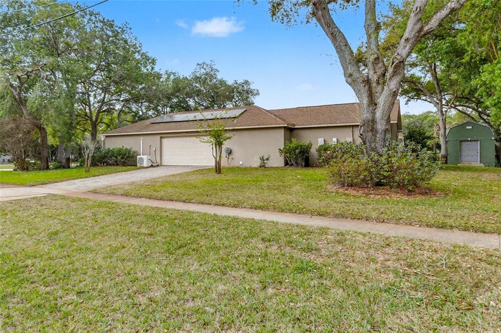 4821 Falcon Boulevard Cocoa, FL 32927 - Photo 8 of 48 a view of a backyard with a garden and plants