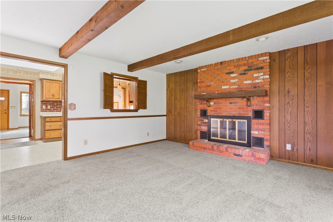 8514 West Ridge Road Elyria, OH 44035 - Photo 9 of 33 Family Room With fireplace and wood beams