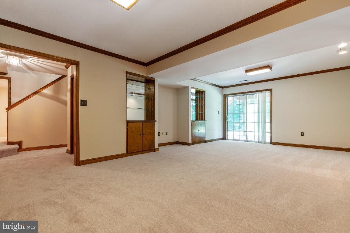 7324 Jenna Road Springfield, VA 22153 - Photo 42 of 64 Recreation room with built-in shelves