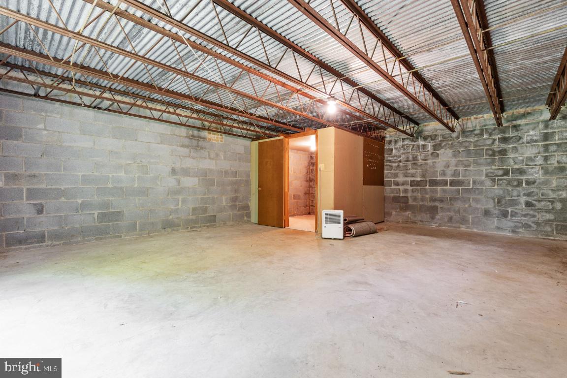 7324 Jenna Road Springfield, VA 22153 - Photo 51 of 64 Rare unfinished workshop indoor and outdoor access
