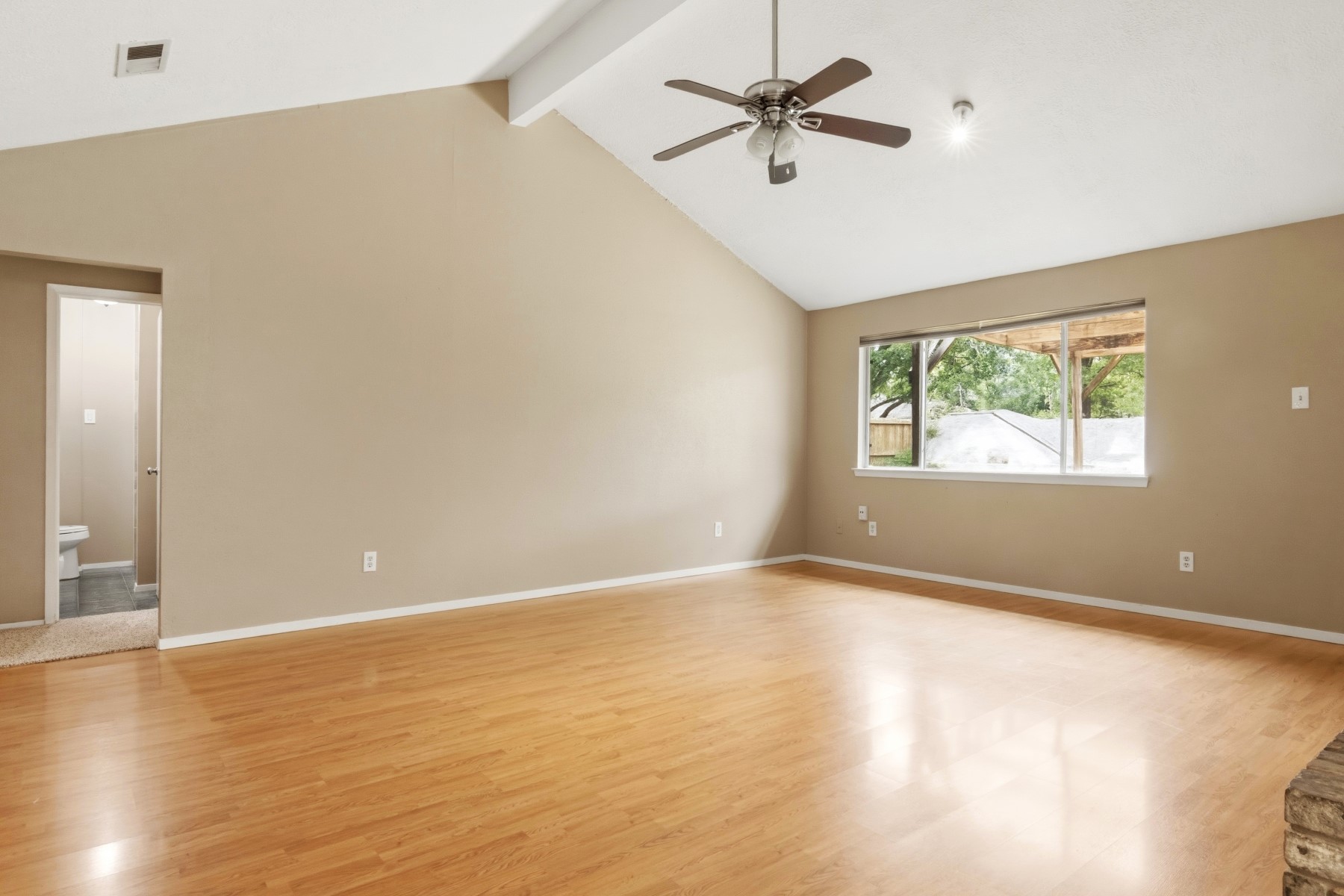 2531 North Spring Drive Spring, TX 77373 - Photo 13 of 24 a view of an empty room with window and wooden floor