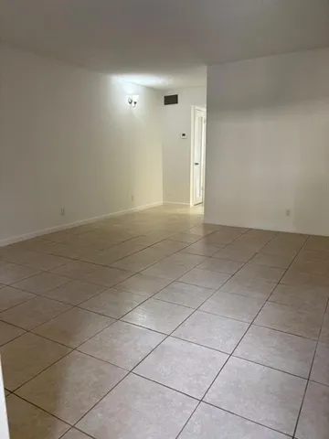 a view of an empty room and utility room