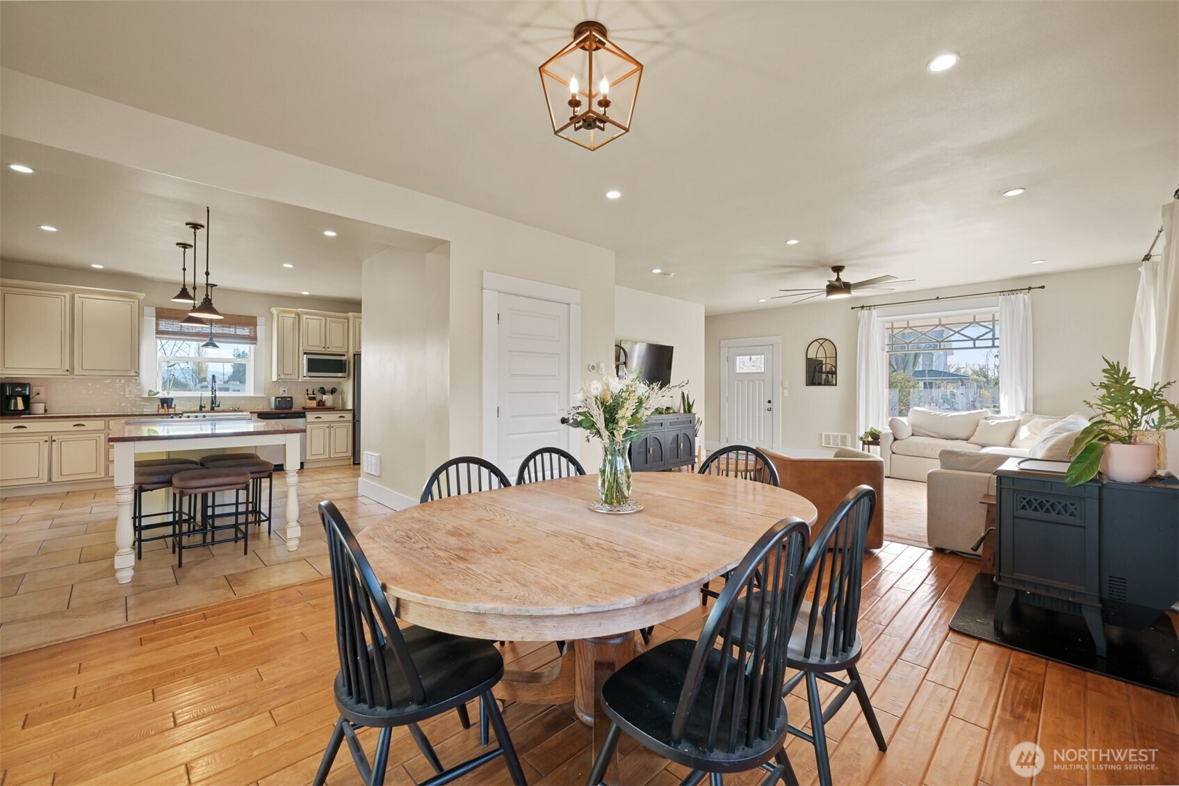 2880 Creasey Road Custer, WA 98240 - Photo 12 of 40 a view of a dining room with furniture and wooden floor