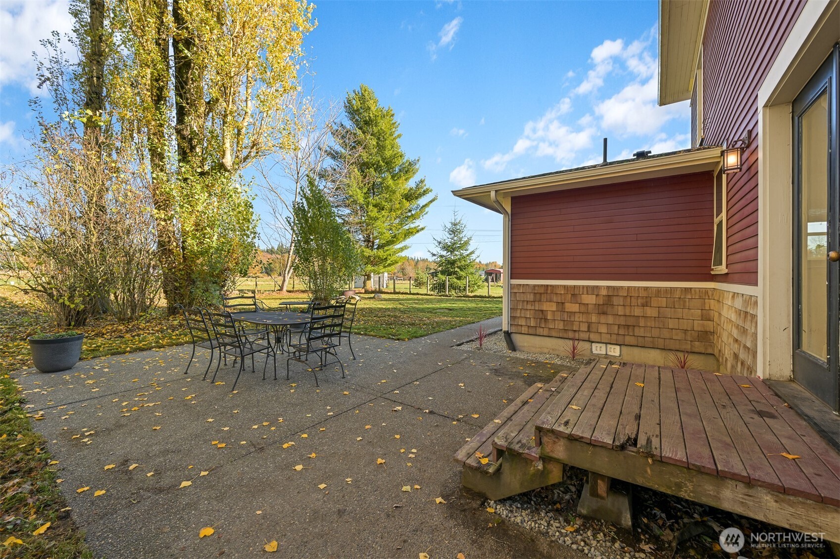 2880 Creasey Road Custer, WA 98240 - Photo 28 of 40 a backyard of a house with table and chairs
